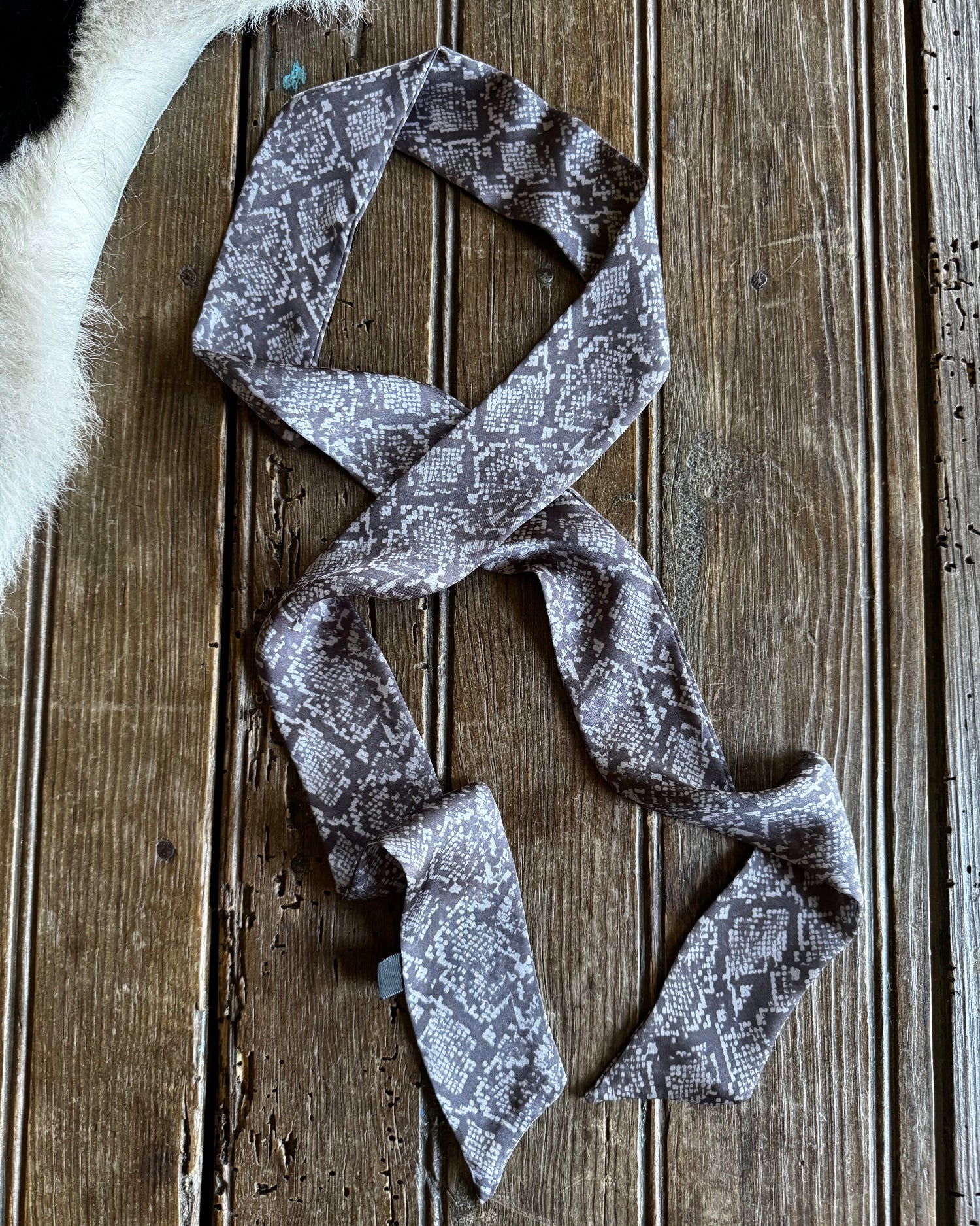 Patterned fabric strip on a wooden surface