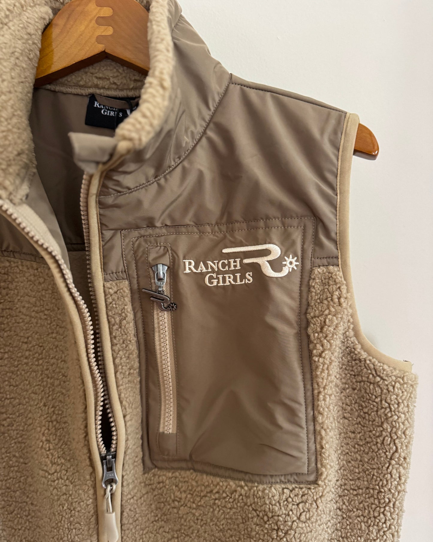Brown fleece vest with 'Ranch Girls' logo on a white background