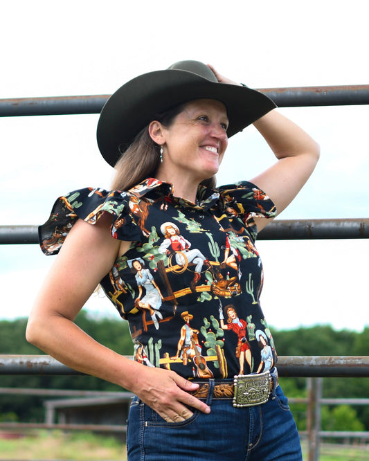 Blake Shirt (Cowgirl Pinup in Black) on model in front of fence 