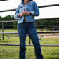 Ella High Rise Slim Trouser Jeans on model standing in front of fence 