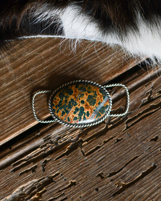 Jasper Twilly Slide on a rustic wooden background