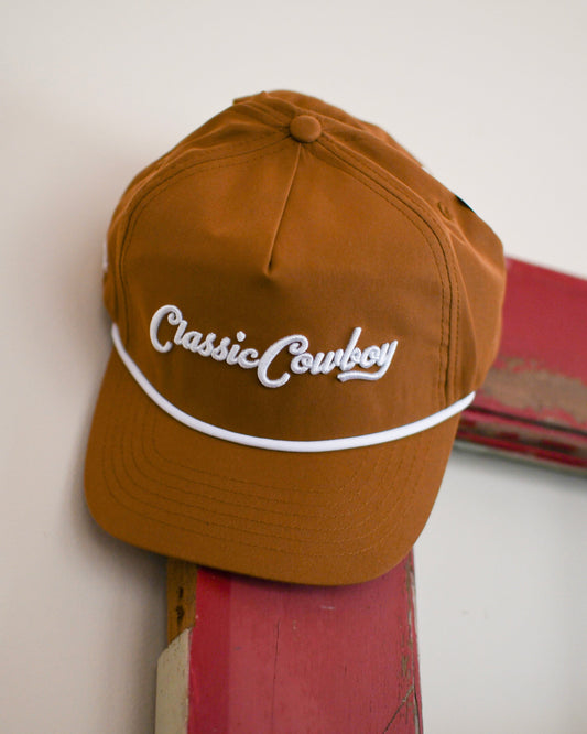 Baseball cap hanging on a door with a white background