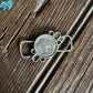 Silver necklace with pendant on a wooden surface