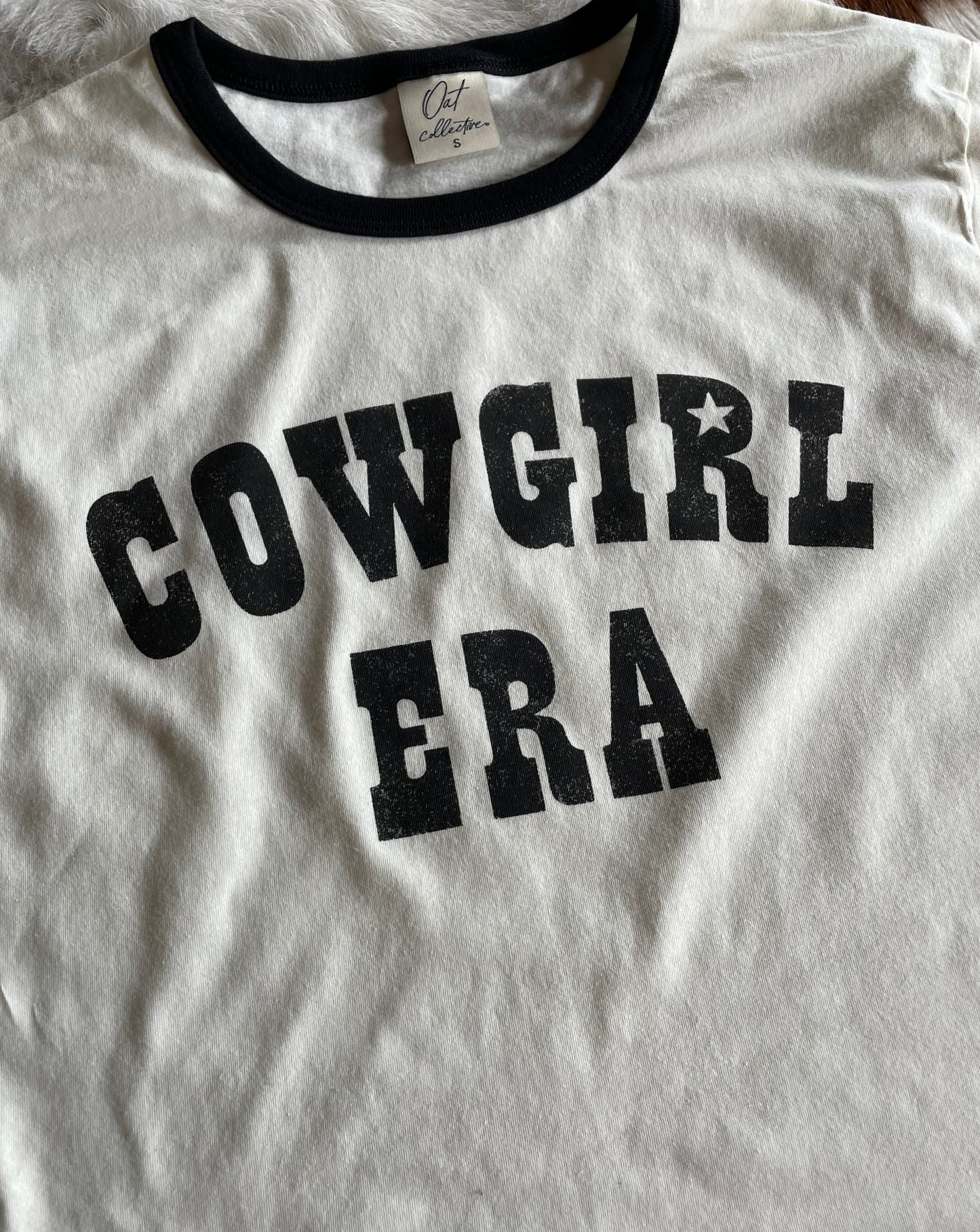 Close up of graphic of Cowgirl Era Ringer Tee