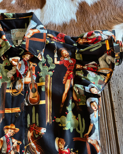 Close up of Blake Shirt (Cowgirl Pinup in Black) on rustic wood background 