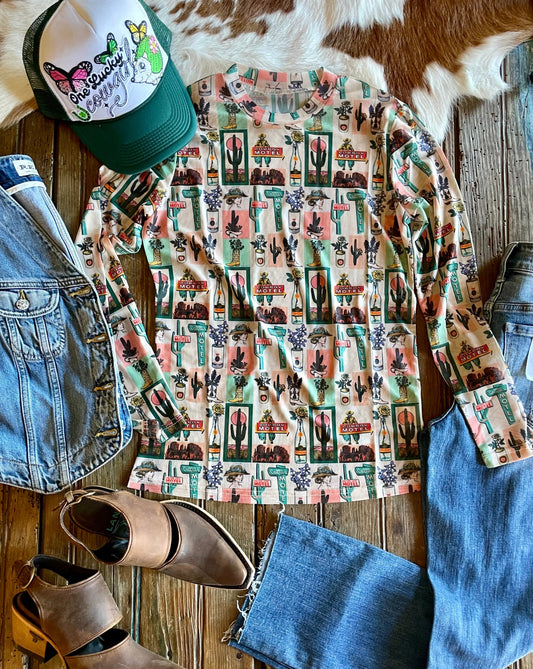 Flat lay of Hotel Cactus Mesh top with cap, denim vest, mules and jeans