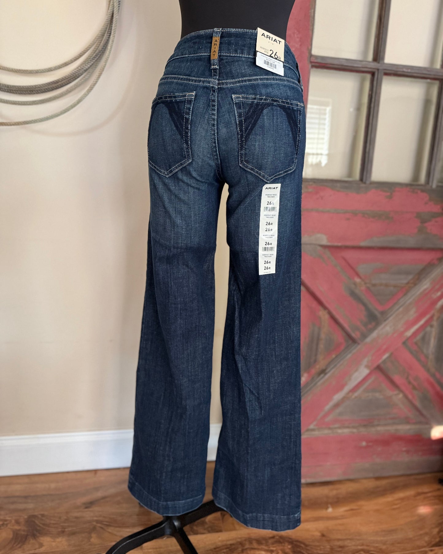 Blue jeans on a mannequin with a rustic background