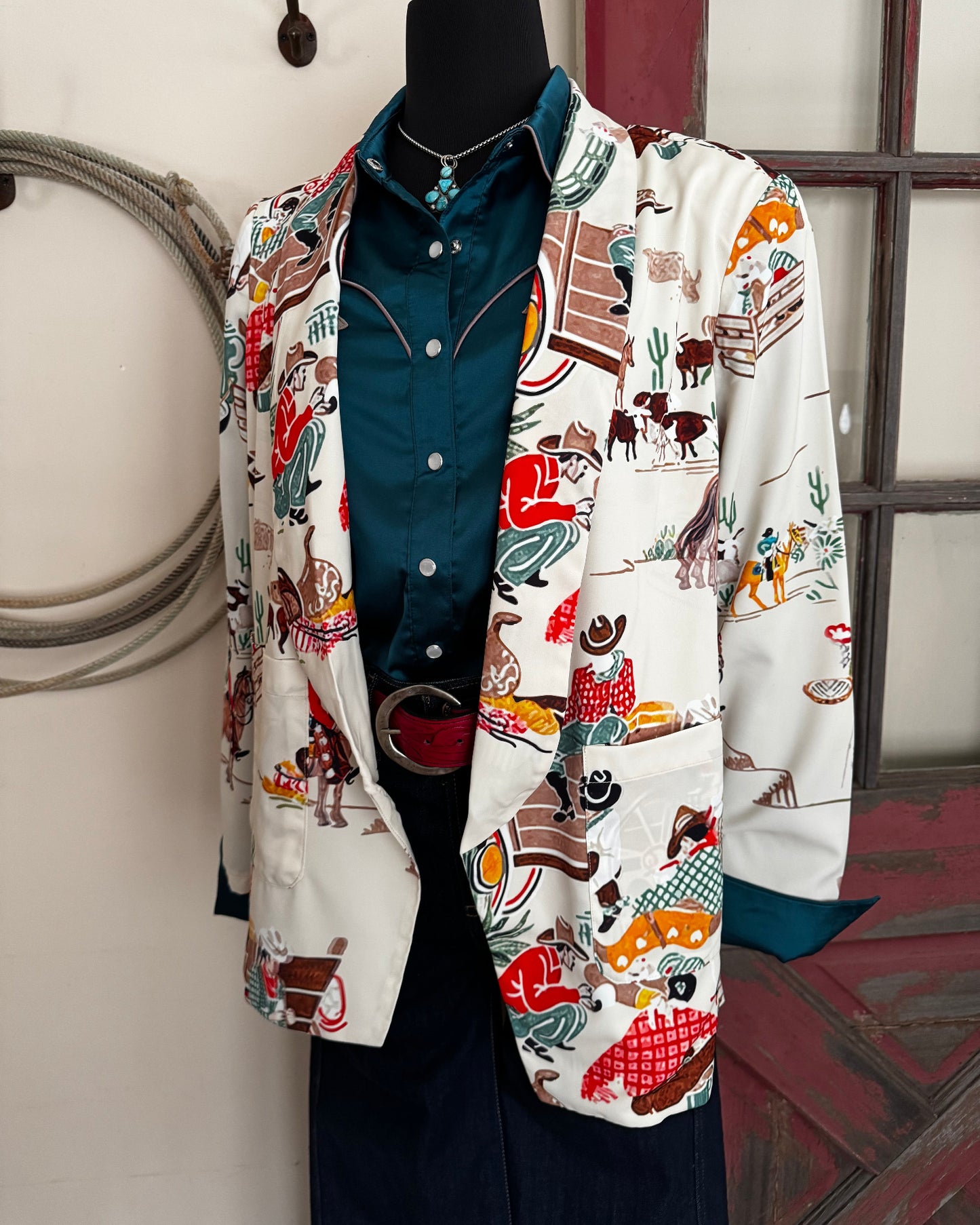 Stack of colorful fabric items on a white surface with a blurred background