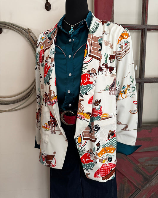 Stack of colorful fabric items on a white surface with a blurred background
