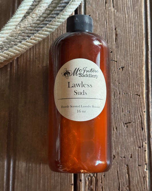 Bottle of Lawless Suds on a wooden surface