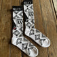 Cactus Alley - Broke A$$ Ranch Performance Socks (Black/White) on rustic wood background