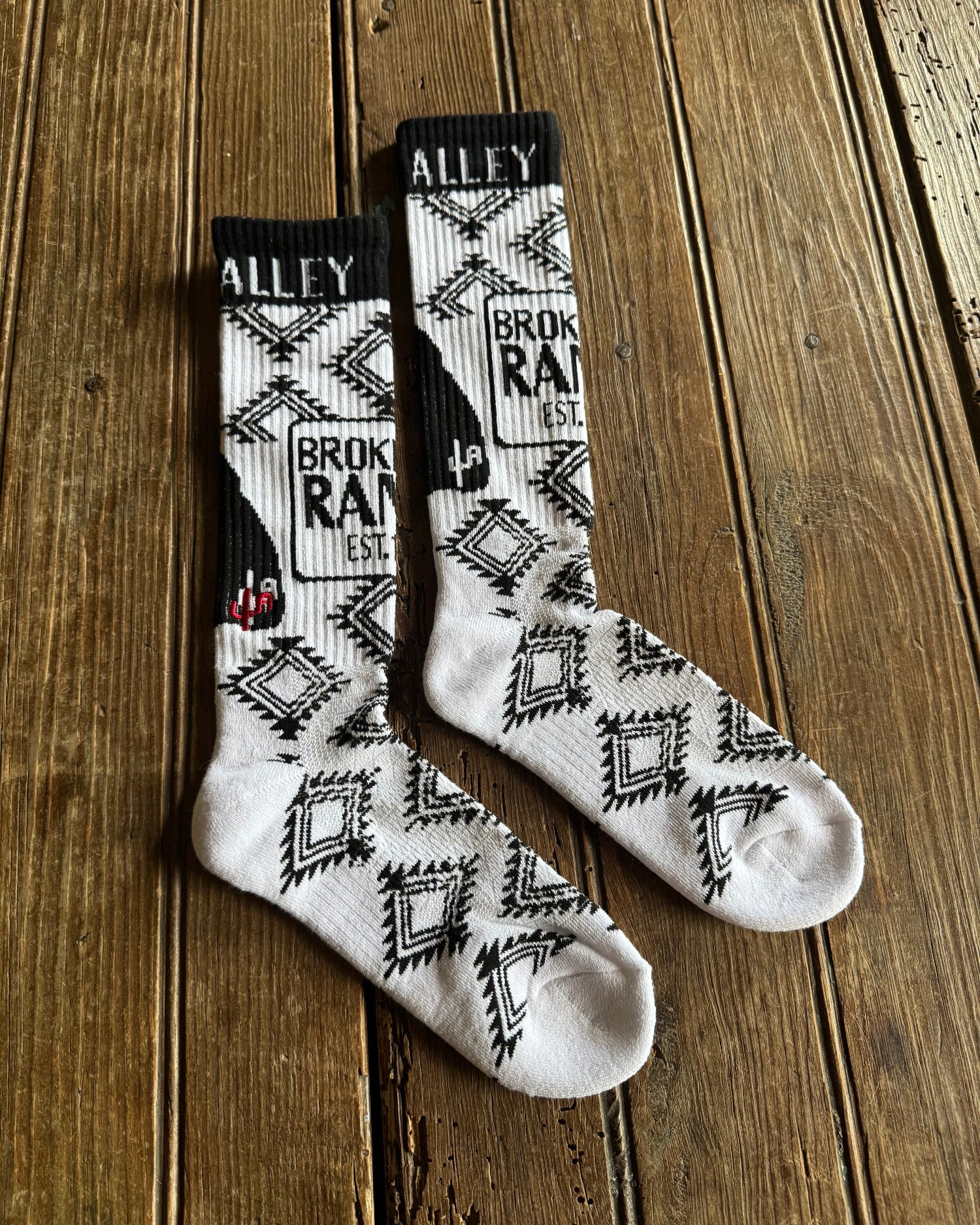 Cactus Alley - Broke A$$ Ranch Performance Socks (Black/White) on rustic wood background
