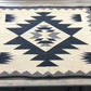 Geometric patterned rug on a wooden floor