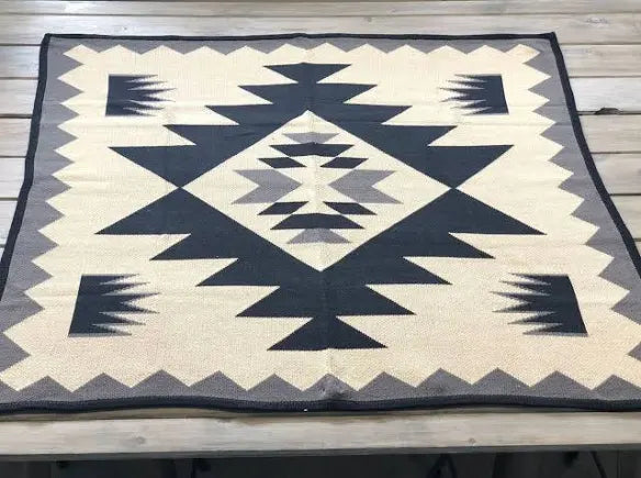 Geometric patterned rug on a wooden floor