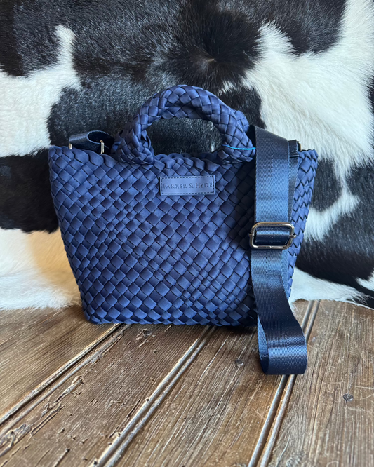 Woven handbag with cowhide background 