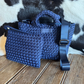 woven handbag and wristlet with cowhide background