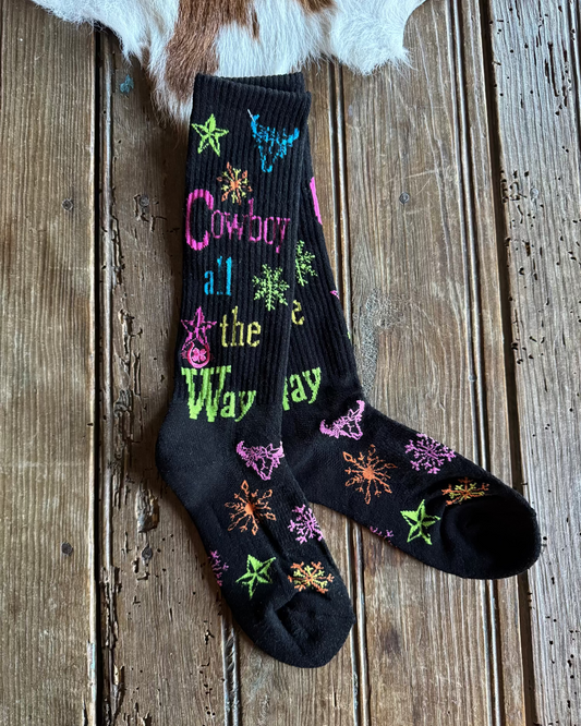 Black socks with colorful designs on a wooden surface